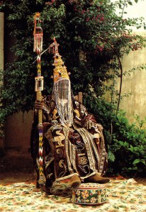A Yoruba king with a beaded crown. These were traditionally word to prevent people from seeing the naked face of a king (Oba) who was considered a divine. It was therefore both dangerous and sacrilegious for a mortal to look upon the face of a king.